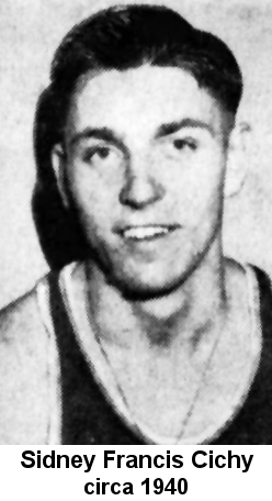 Black and white newspaper portrait photo of a young man with oiled dark hair, wearing a basketball jersey and a thin chain around his neck.